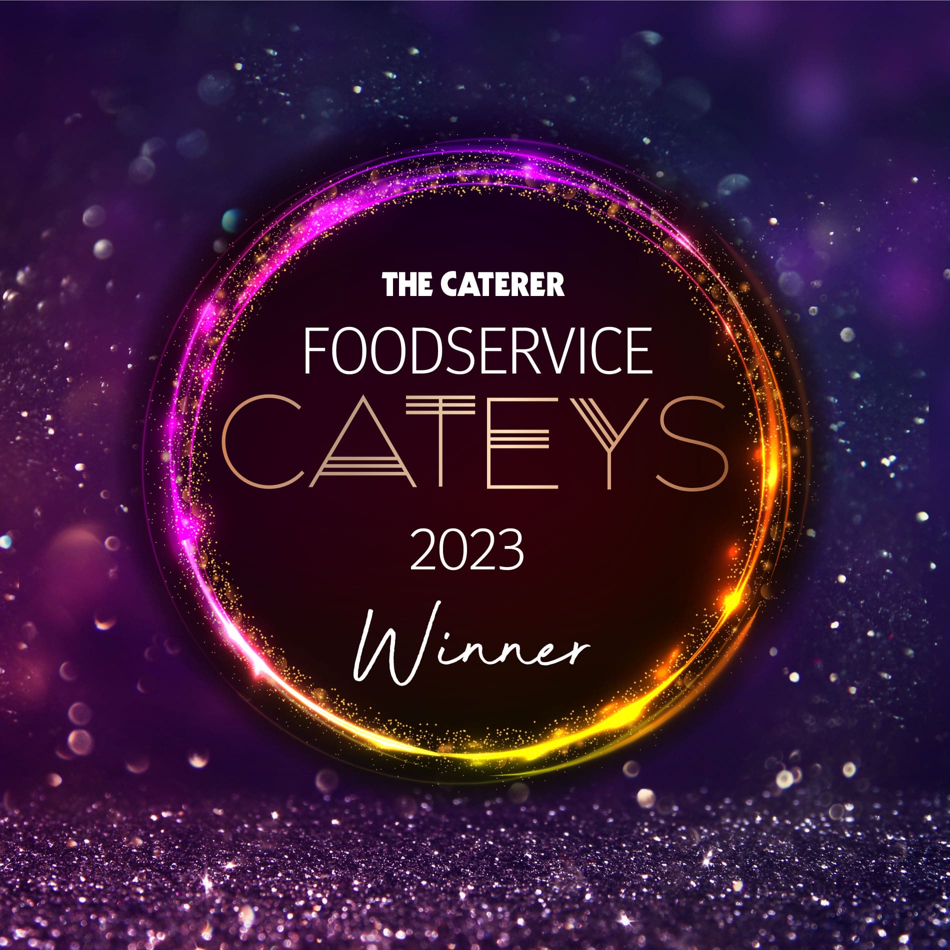 A glowing circular neon sign reads: The Caterer Foodservice Cateys 2023 Winner against a purple, sparkling background.