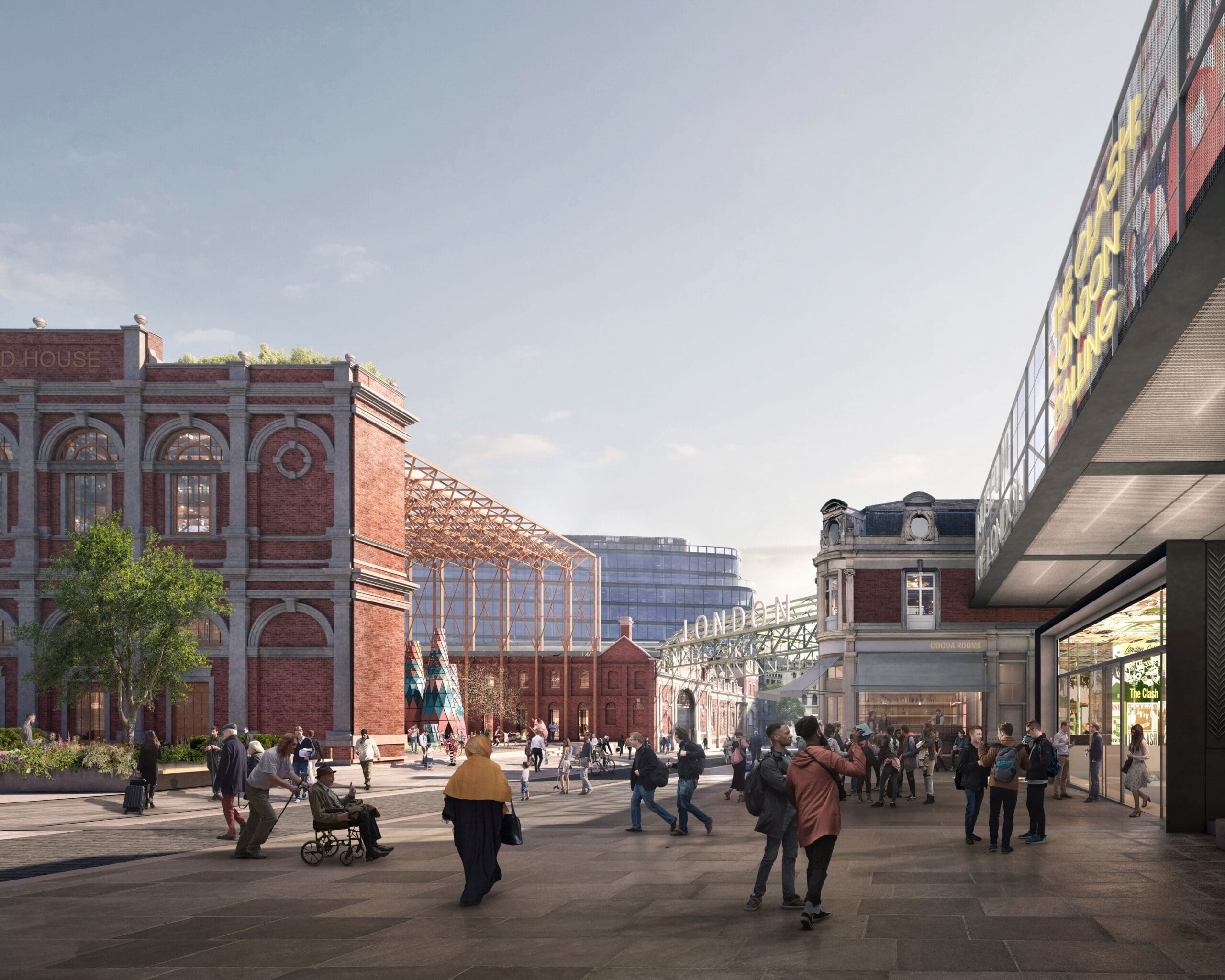 A lively urban scene with people walking and socialising near historic red-brick buildings and a modern glass structure under a clear sky. Some greenery and public art are visible, blending old and new architecture.